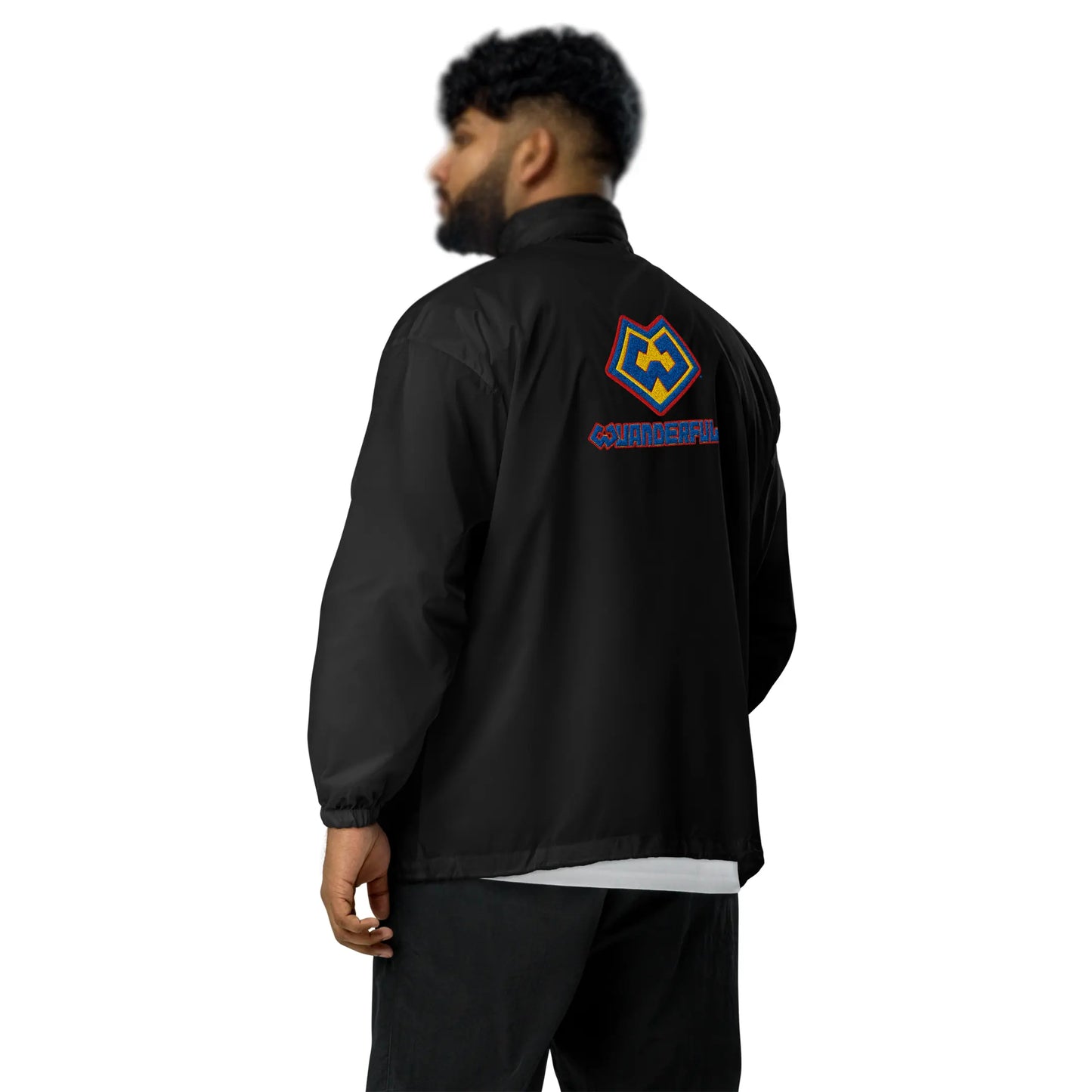 Back angle view of a man wearing a Wuanderful Locos windbreaker jacket